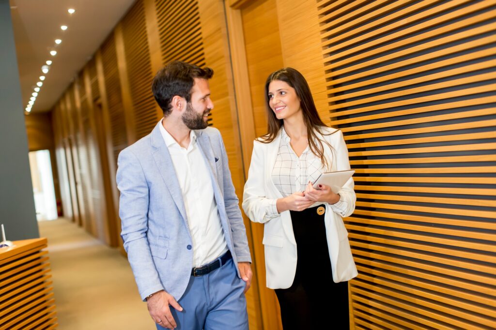Business couple with tablet in the office